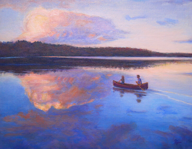 Canoe at sunset on a calm lake