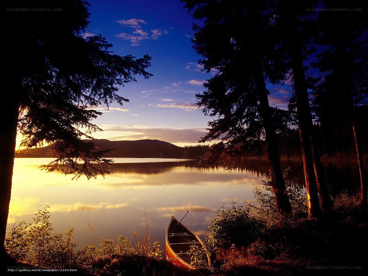 Canoe at sunset on a calm lake