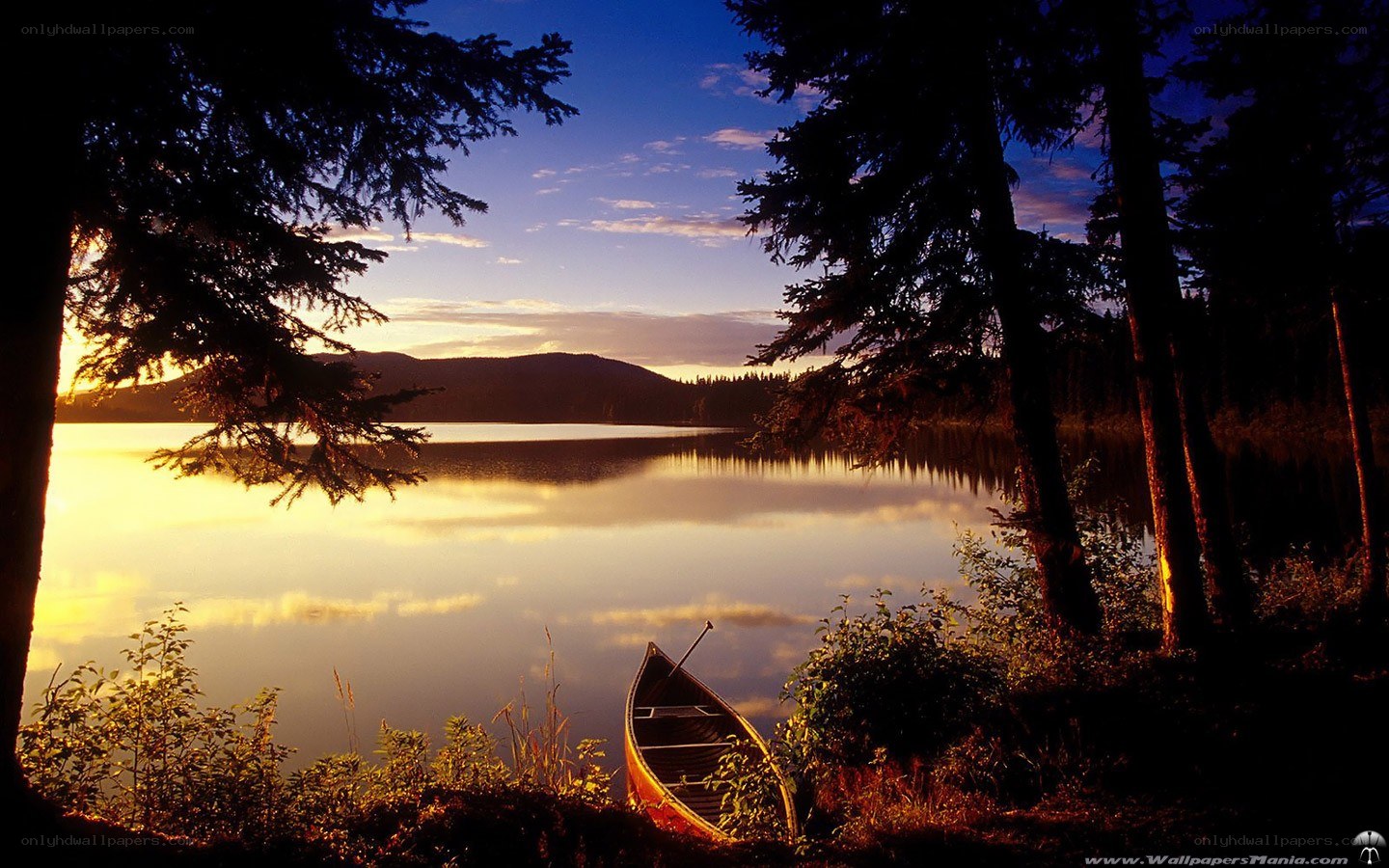 Canoe at sunset on a lake