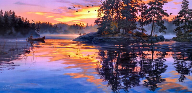 Canoe at sunset on a misty lake