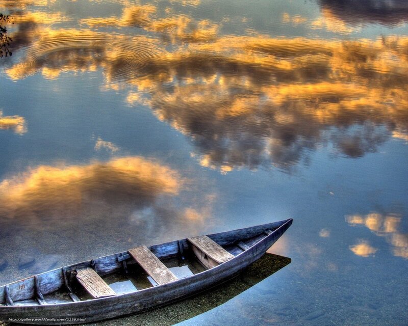 Canoe at sunset reflection