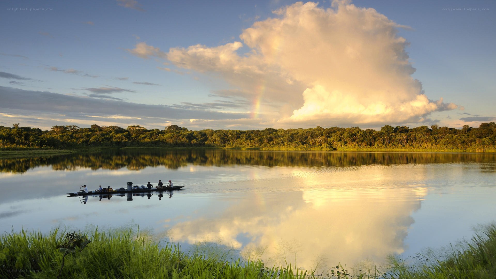 Canoe on a calm river at sunset