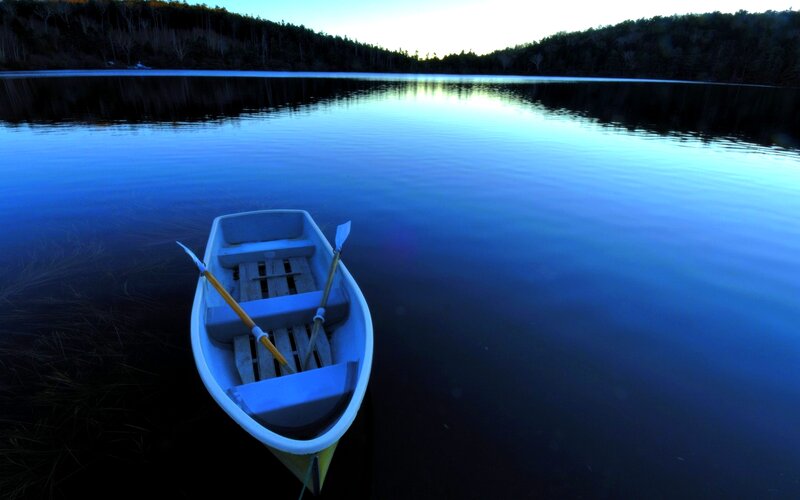 Canoe on a Lake — Blue, Serene, Sunset, Photograph