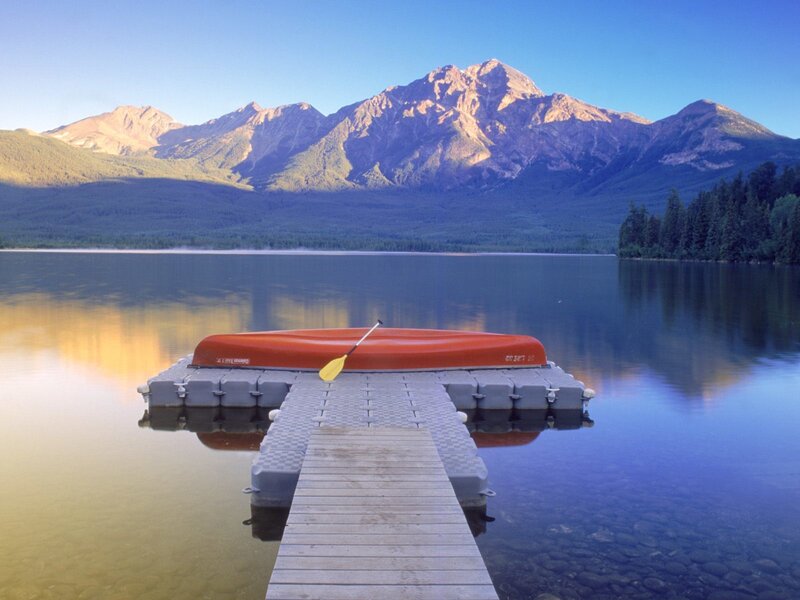 Canoe on a lake with mountains