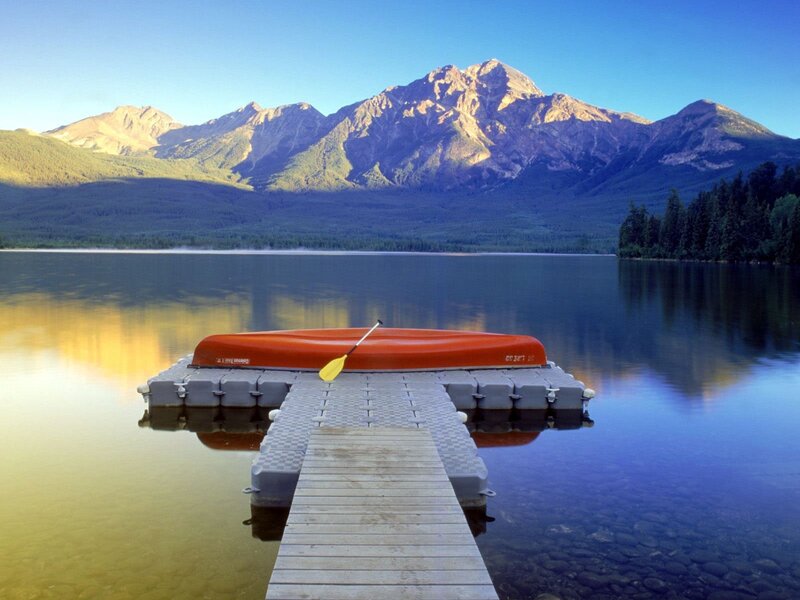 Canoe on a lake with mountains