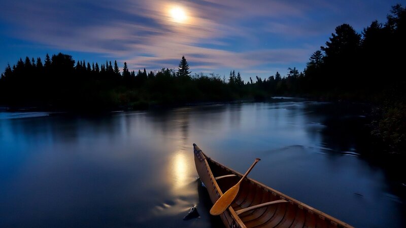 Canoe on a moonlit river