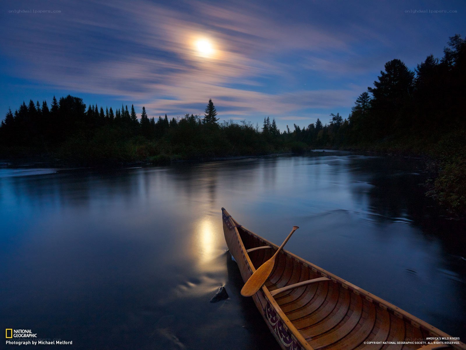 Canoe on a moonlit river
