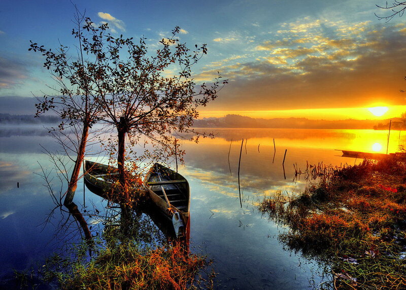 Canoe on Lake Shore — Blue, Serene, Sunrise