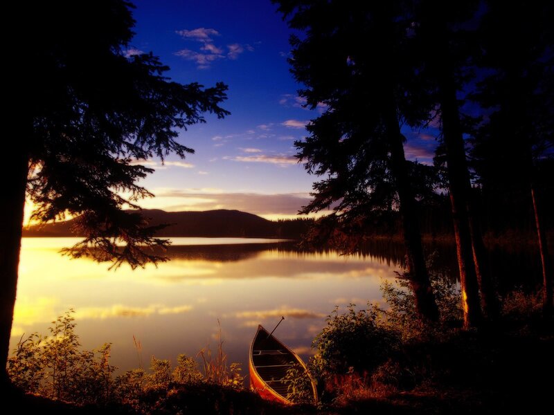 Canoe on Lake Shore — Blue, Serene, Sunset, Photograph, Trees, Mountain, Boat