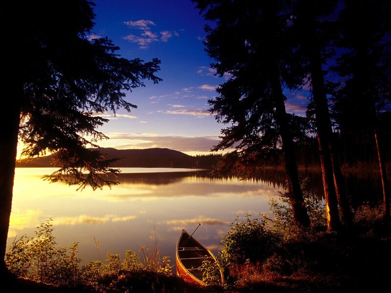 Canoe on Lake Shore — Blue, Serene, Sunset, Photograph, Trees, Mountain