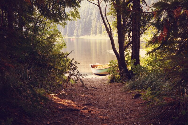 Canoe on Lakeshore — Green, Serene