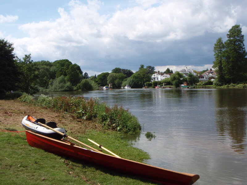 Canoe on Riverbank — Green, Serene