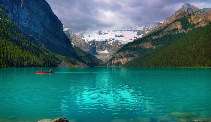 Canoe on turquoise lake