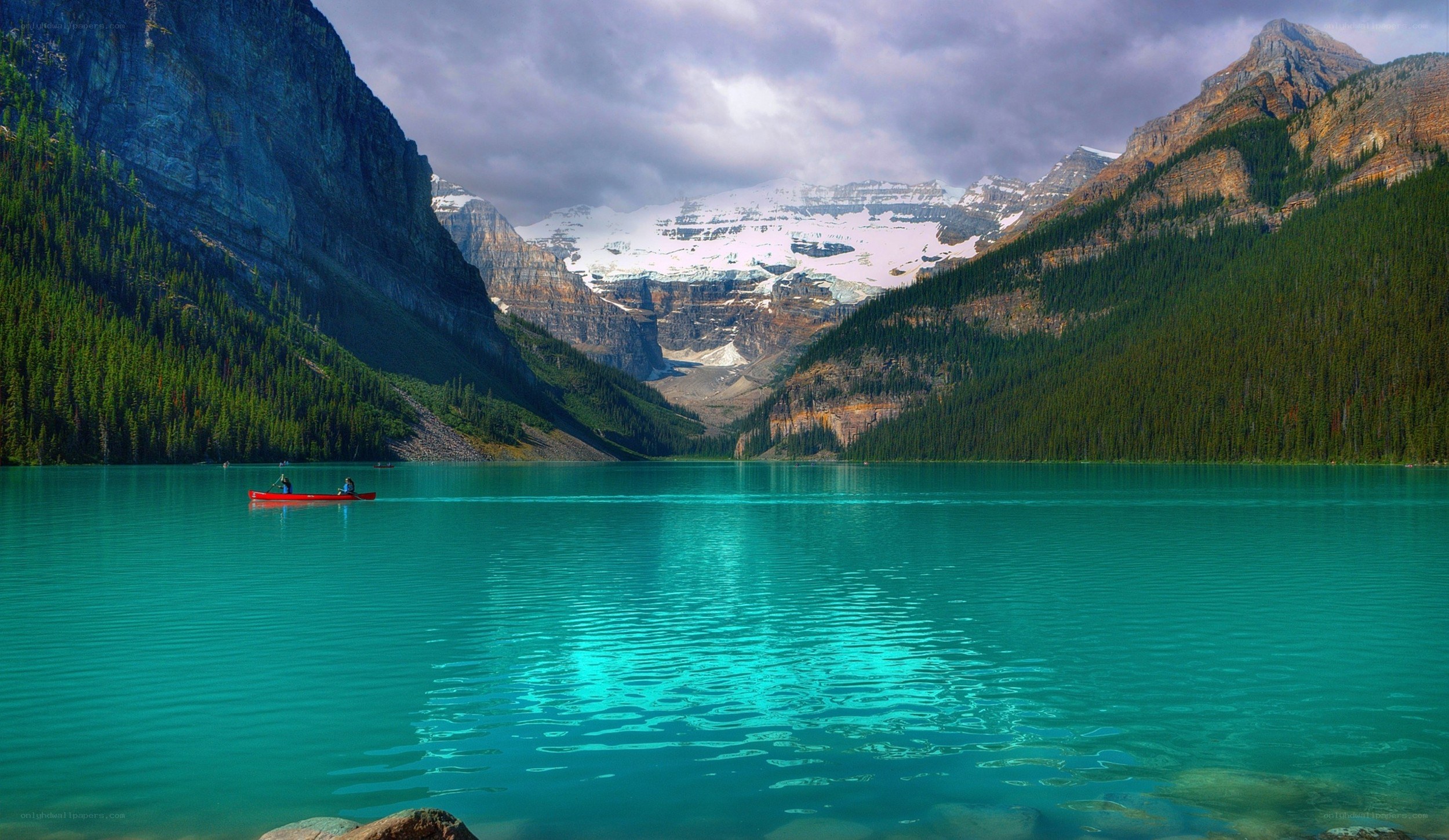Canoe on turquoise lake