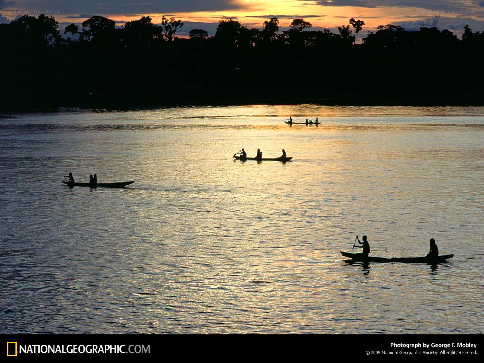 Canoeing at sunset on a river