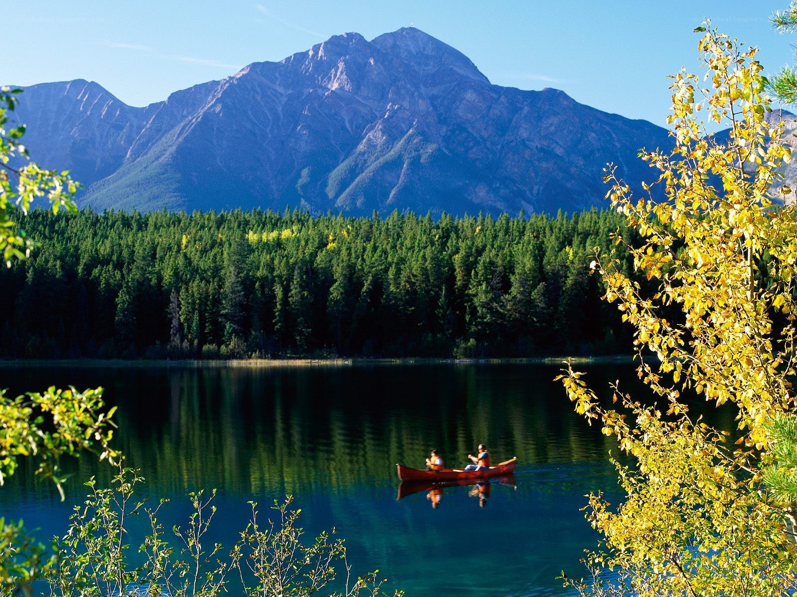 Canoeing by a mountain lake