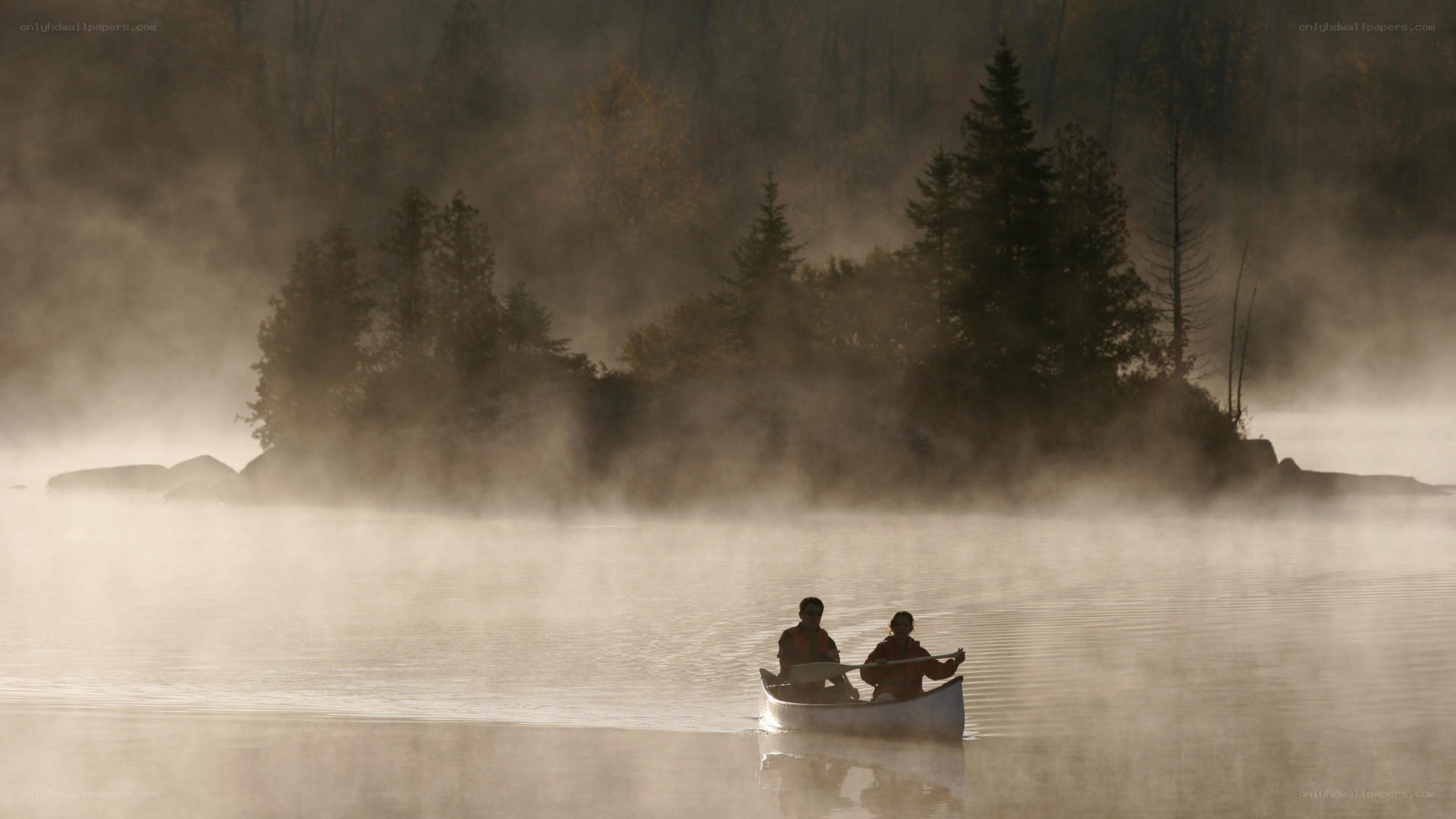 Canoeing on a misty lake
