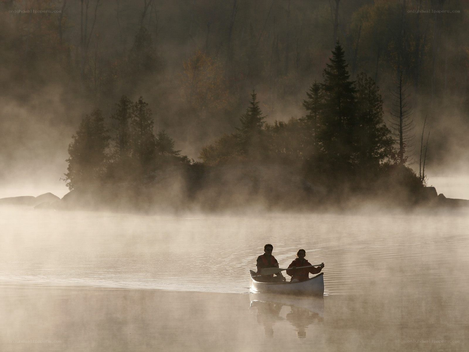 Canoeing on a misty lake