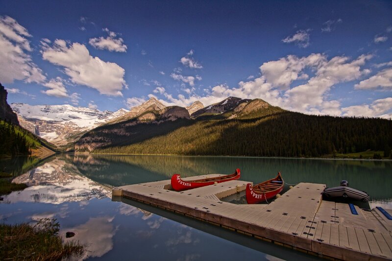 Canoes on a Lake Dock — Blue
