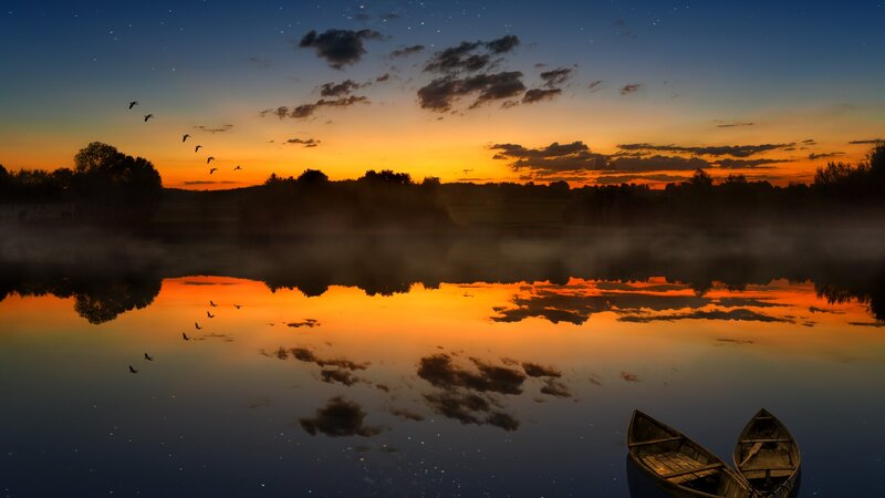 Canoes on a Misty Lake