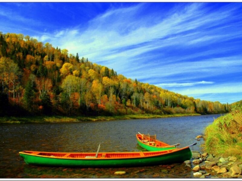Canoes on a river in autumn