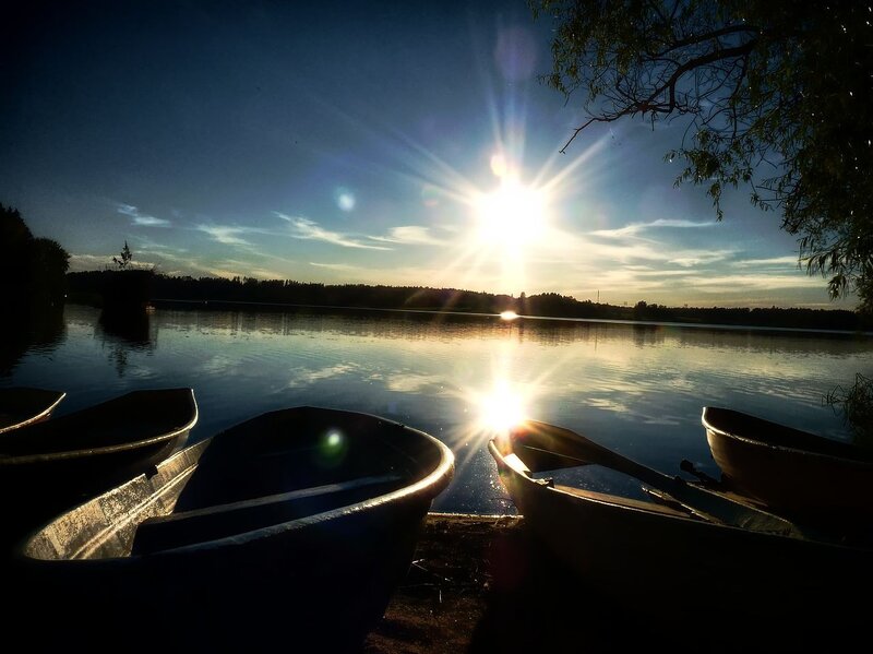 Canoes on Lake Shore — Blue, Serene, Sunset, Photograph