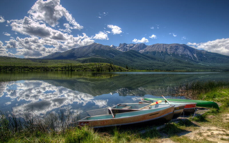 Canoes on Lake Shore — Blue