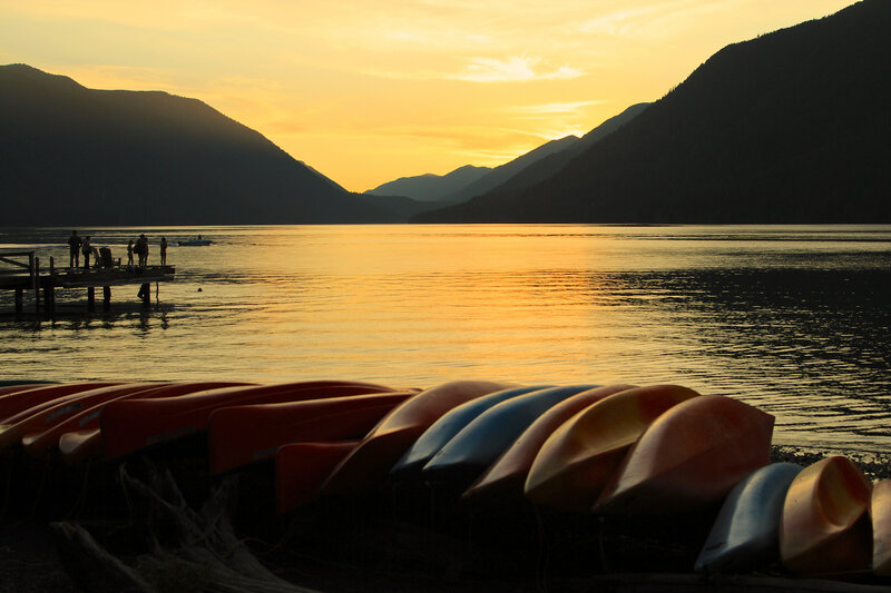 Canoes on Lake Shore — Orange, Serene