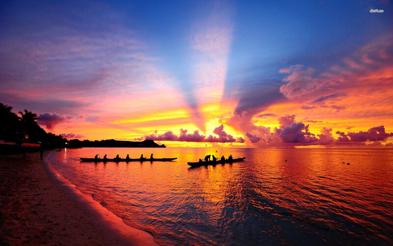 Canoes on Ocean at Sunset