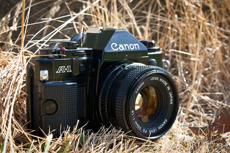 Canon A-1 camera in grass