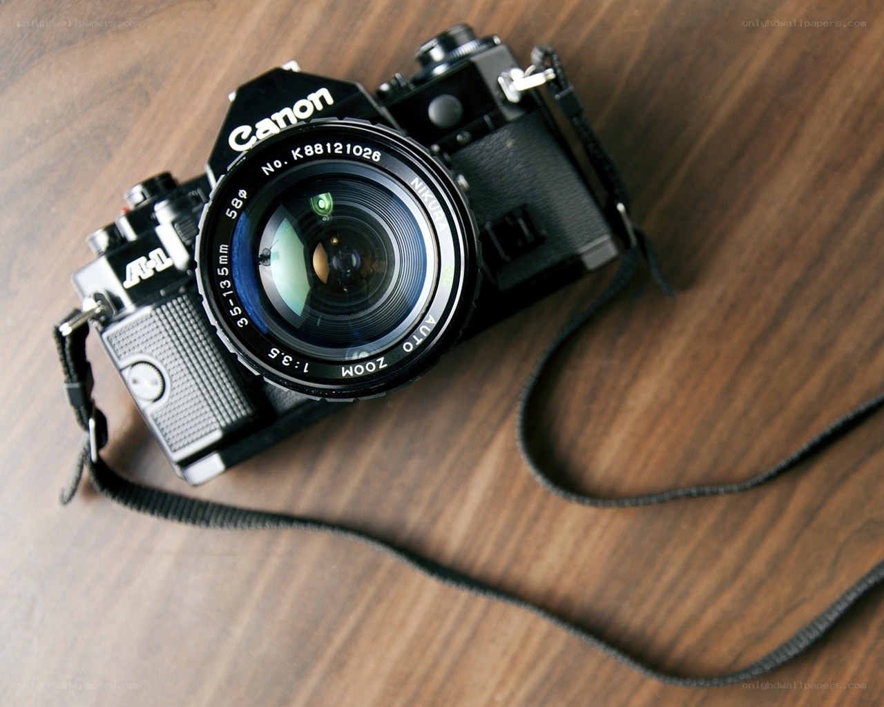 Canon A-1 camera on wood