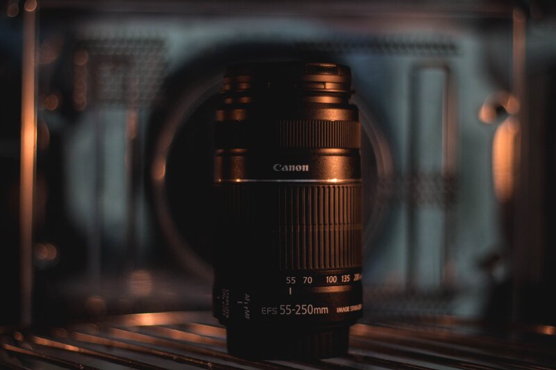 Canon Camera Lens — Black, Dramatic, Photograph, Shelves