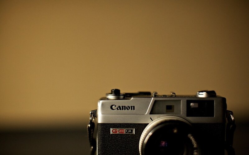 Canon camera on a plain background