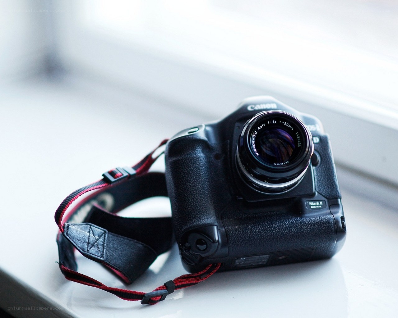 Canon camera on windowsill