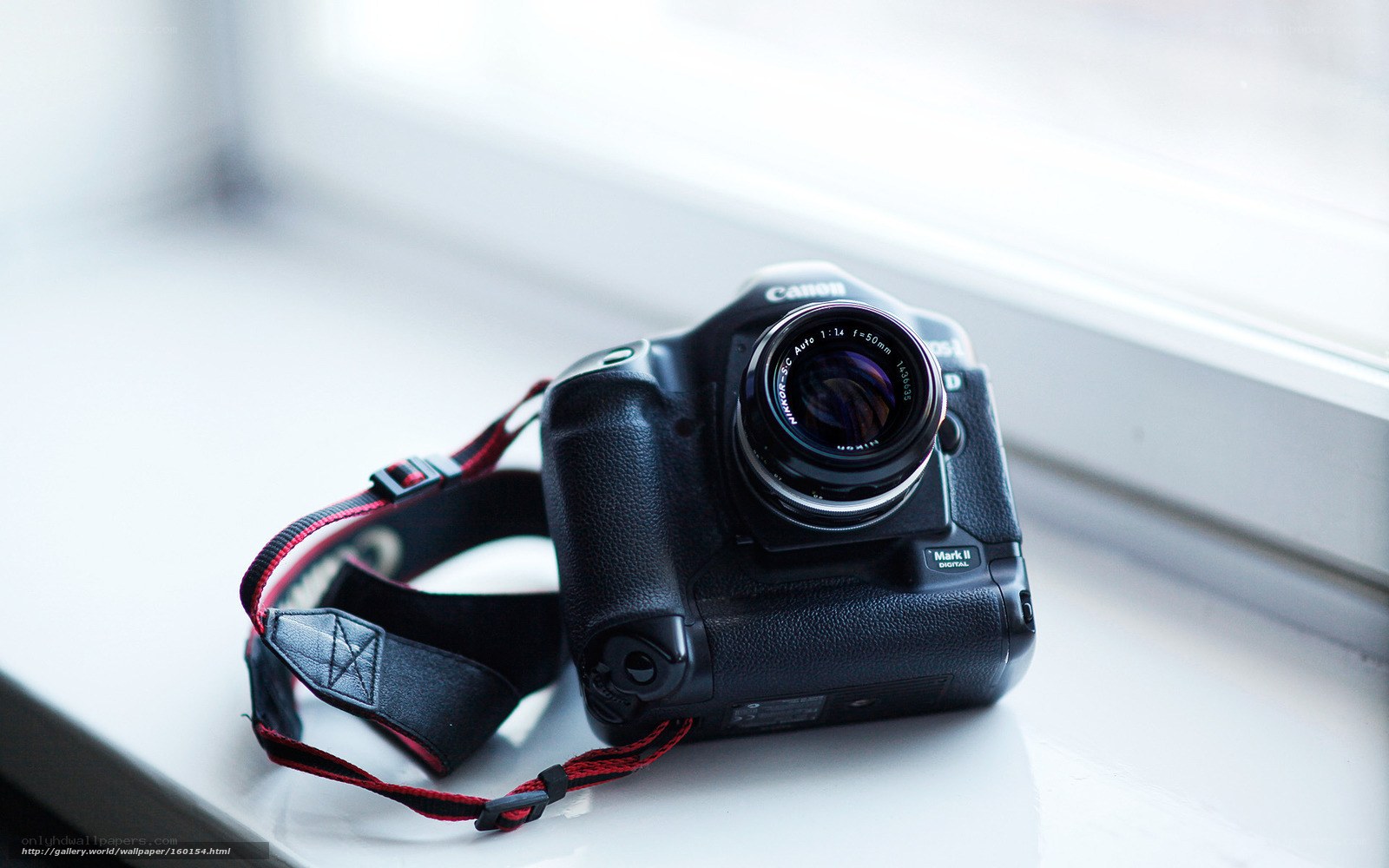 Canon camera on windowsill
