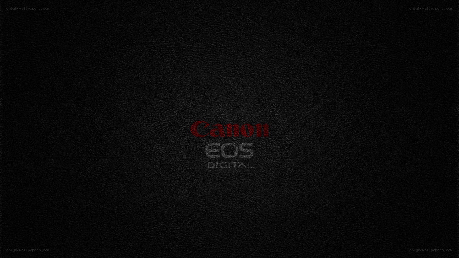 Canon EOS Digital logo on black leather