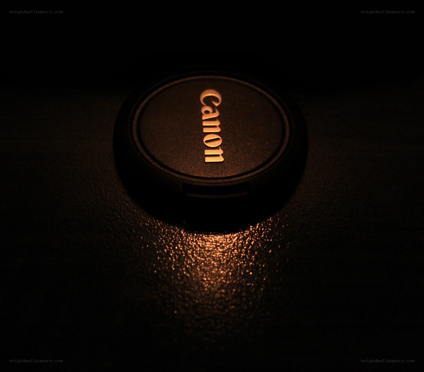 Canon lens cap in dim light