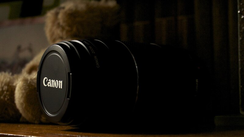 Canon lens on wooden surface