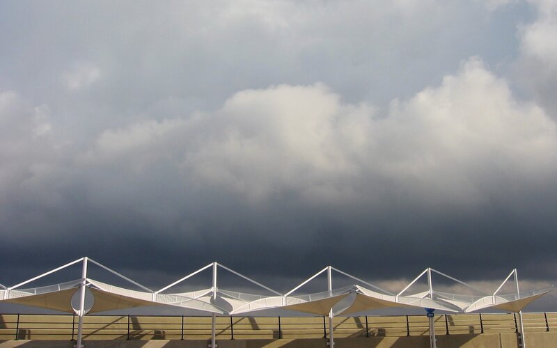 Canopy structures under stormy sky