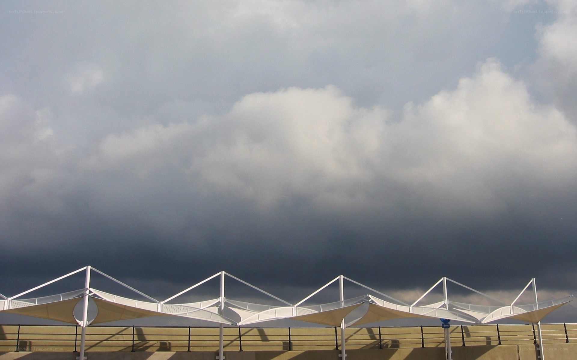 Canopy structures under stormy sky