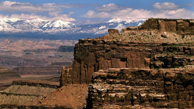 Canyon with snow-capped mountains