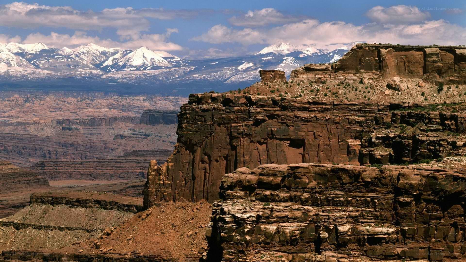 Canyon with snow-capped mountains