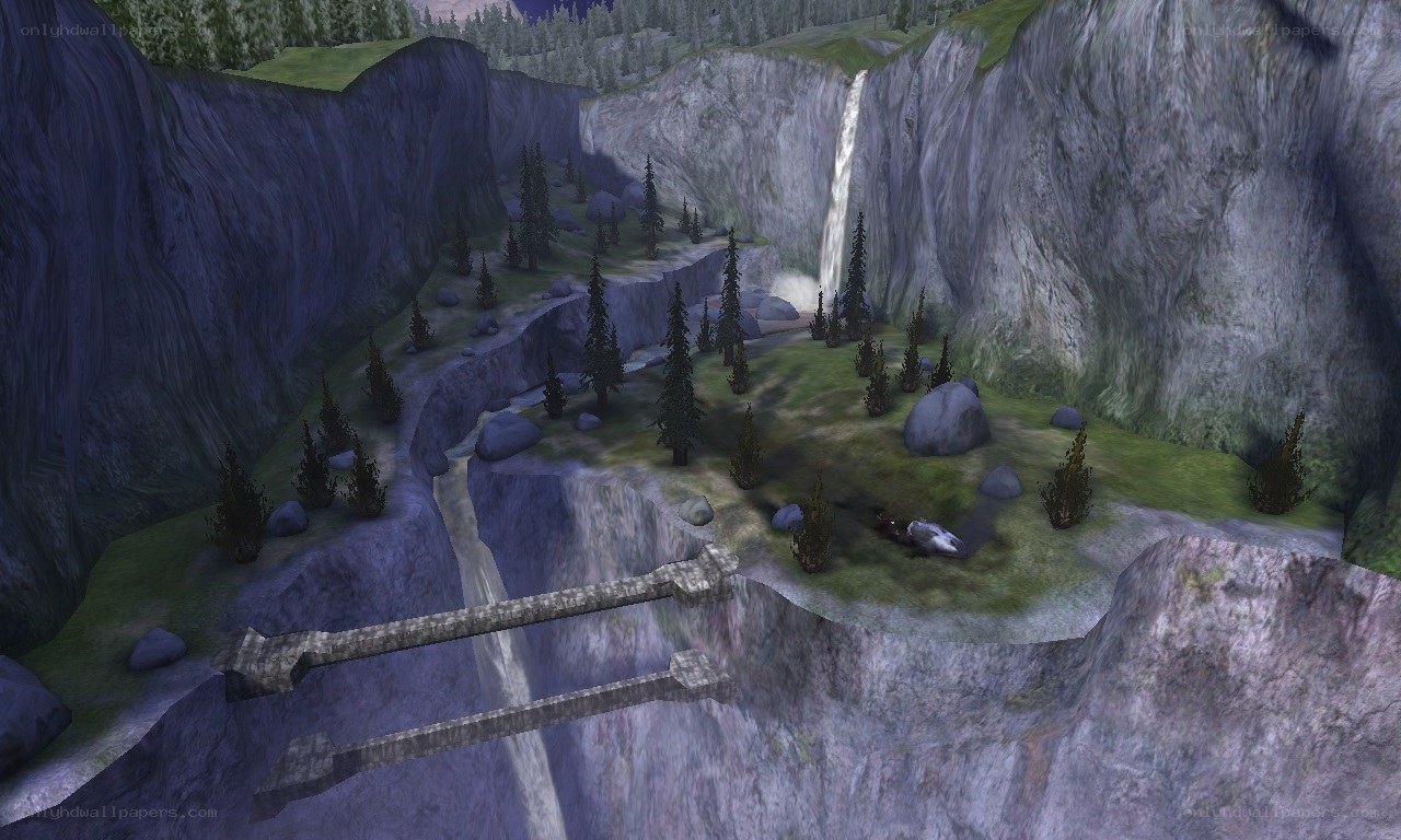 canyon with waterfall and bridge