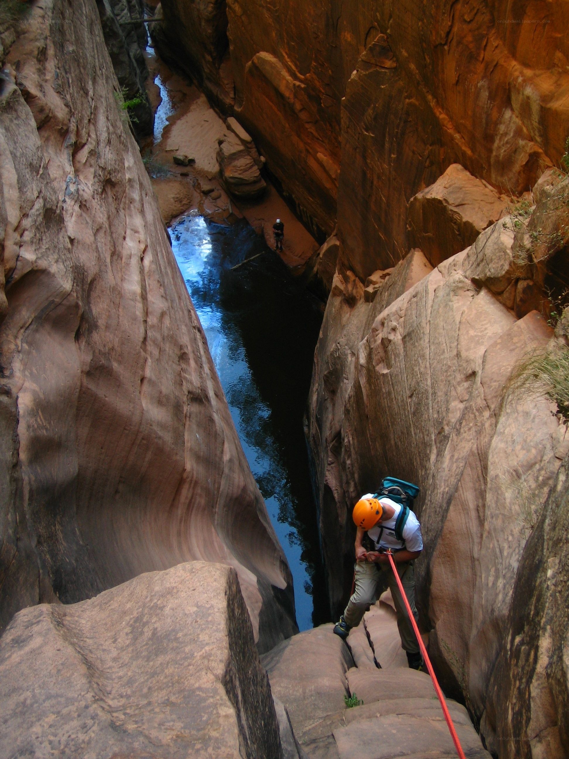 Canyoneering in a narrow canyon