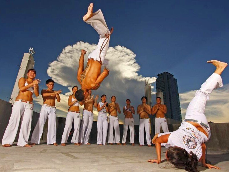 Capoeira performers on rooftop