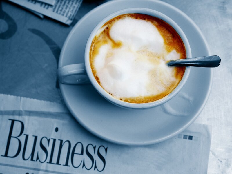 Cappuccino on newspaper