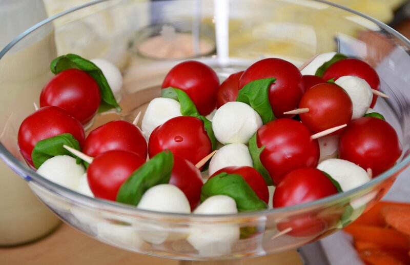 Caprese skewers in a glass bowl