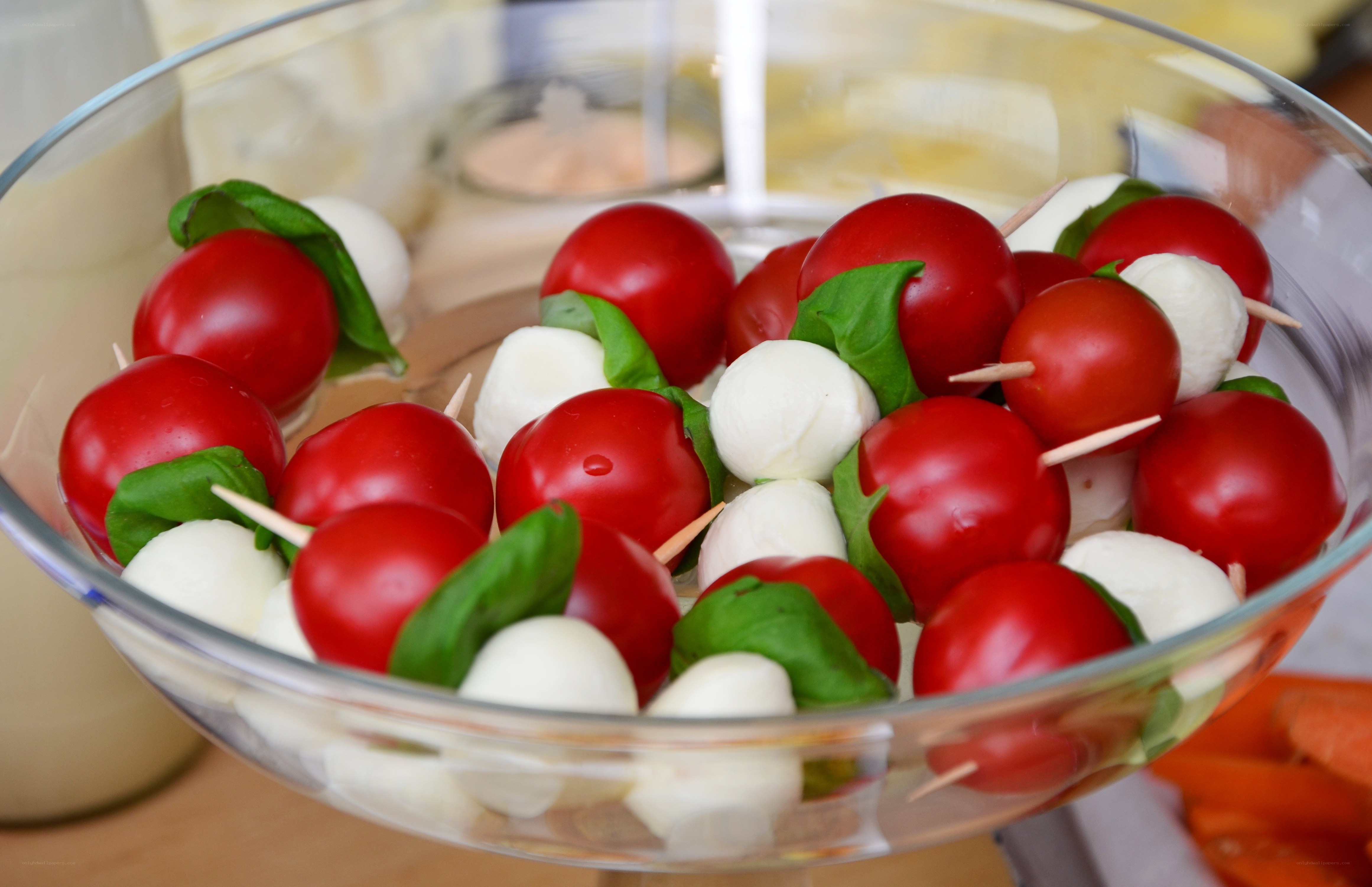 Caprese skewers in a glass bowl