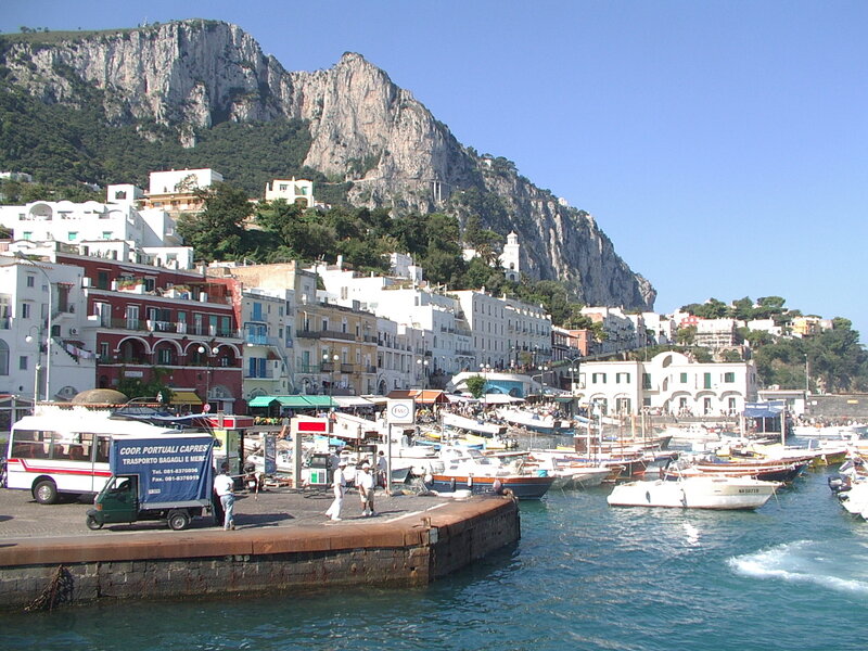 Capri harbor with mountain backdrop
