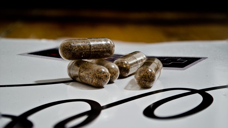 Capsules on White Surface